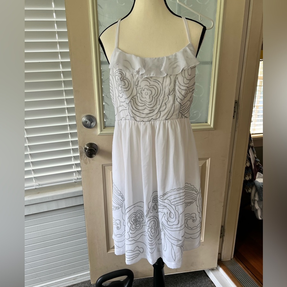 Johnny Martin size L white and silver floral
Sequined dress. Racer back ruffled